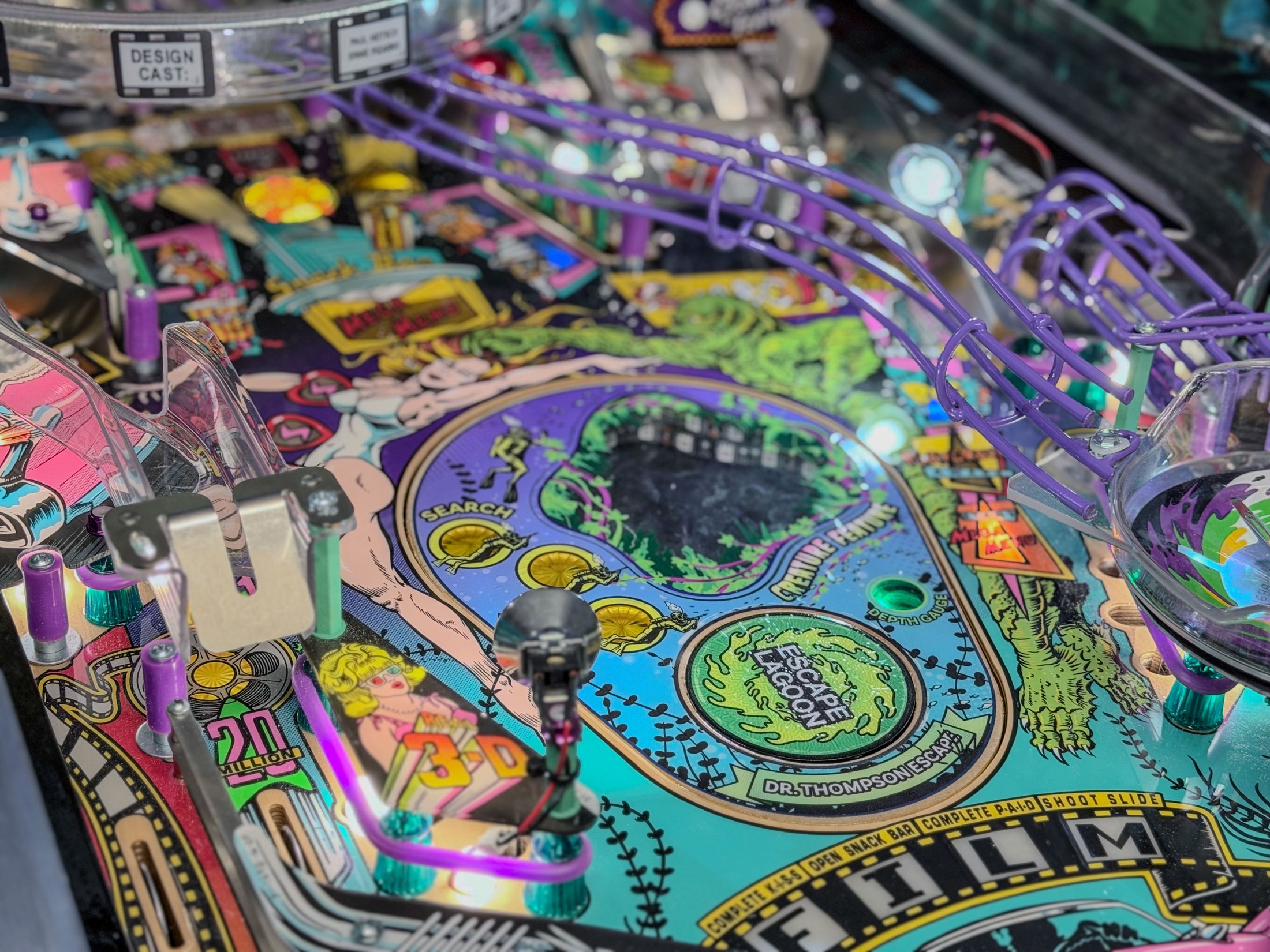 Illuminated Escape Lagoon installation viewed from the cabinet side