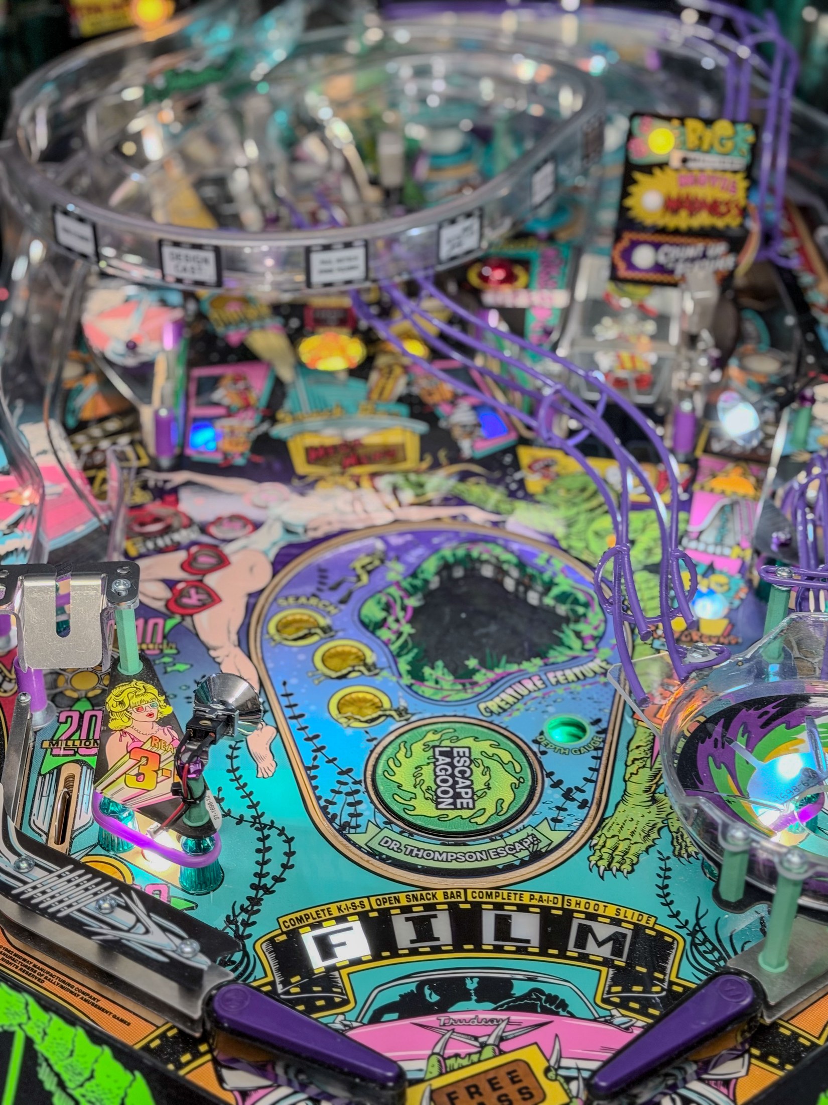 Illuminated Escape Lagoon feature viewed across the playfield