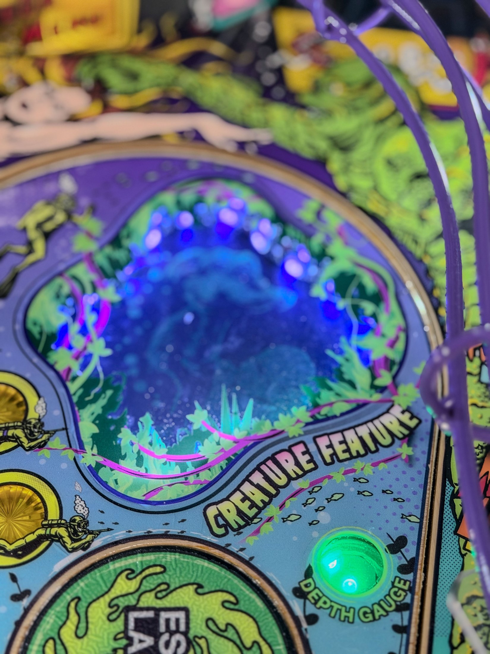 Blue-lit Creature artwork inside the Escape Lagoon window